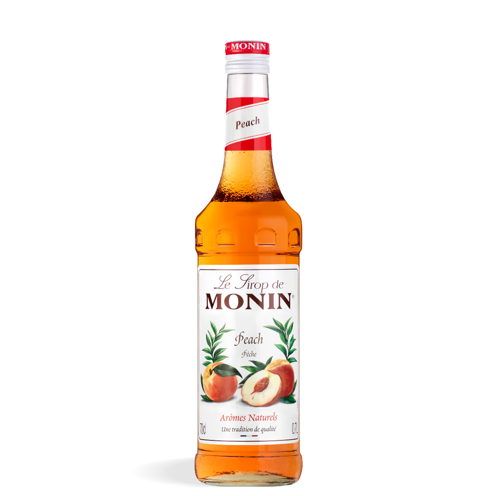 Boca Monin Breskva Sirupa 0,7L s etiketom zrelih bresaka i prozirnim zlatnim sirupom